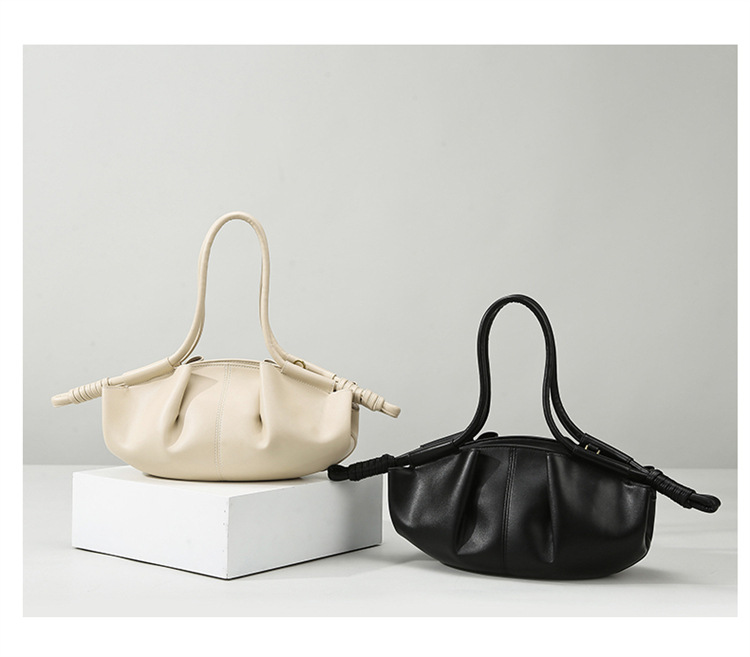 Cream and black pleated shoulder bags