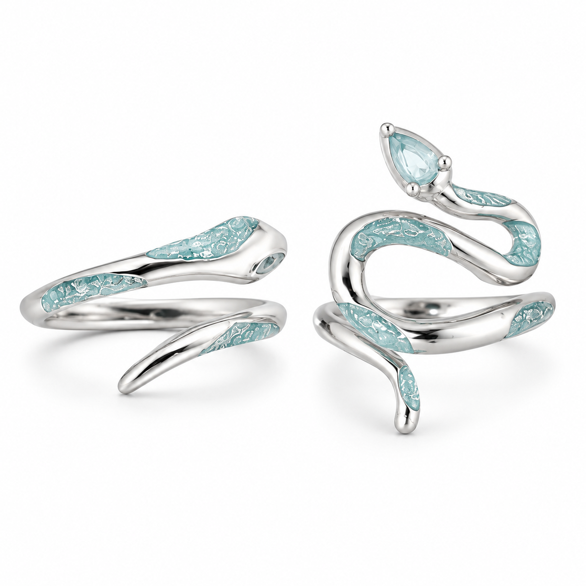Two silver-tone pale blue snake ring styles on white