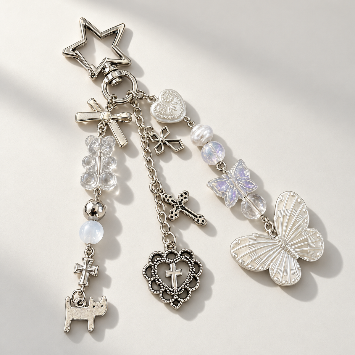 Butterfly and star charm keychain on a light background