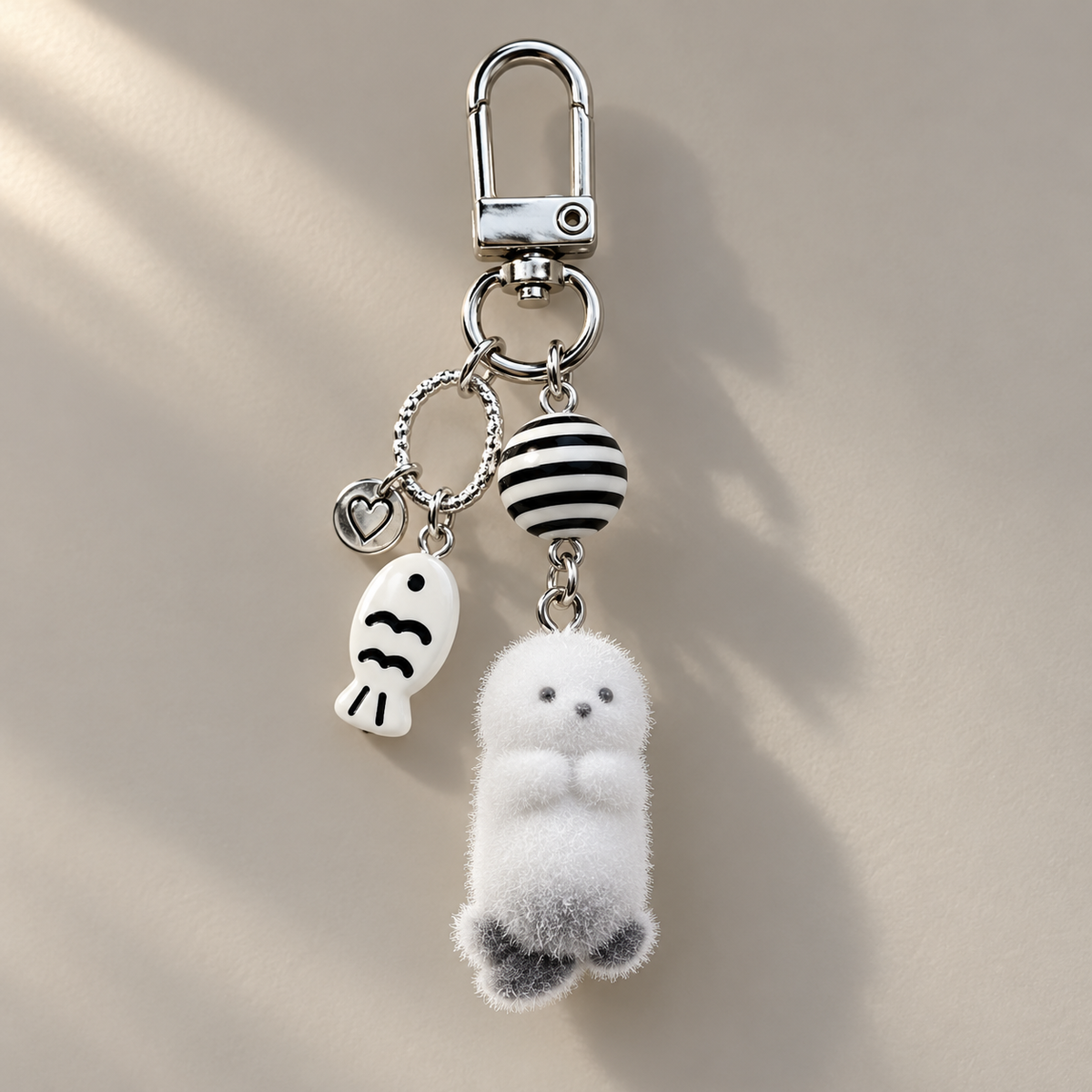 White animal charm with grey feet