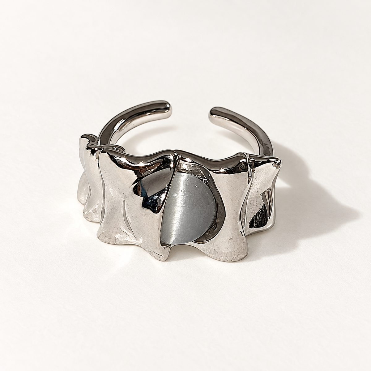 Folded silver-tone open ring with grey stone