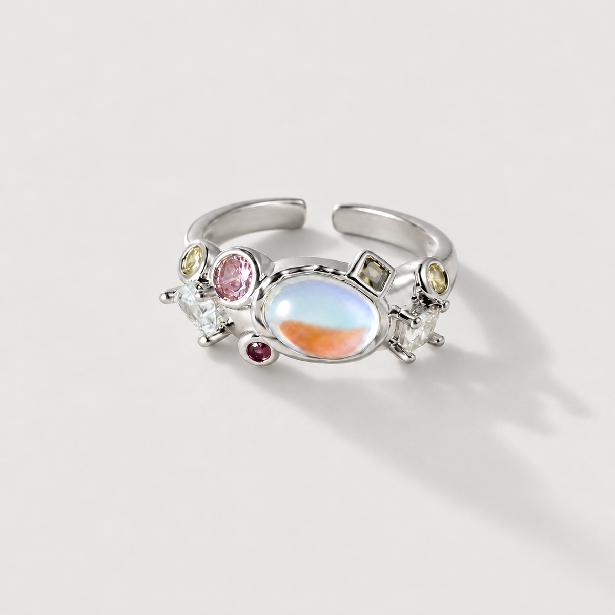 Iridescent cluster open ring on ivory background