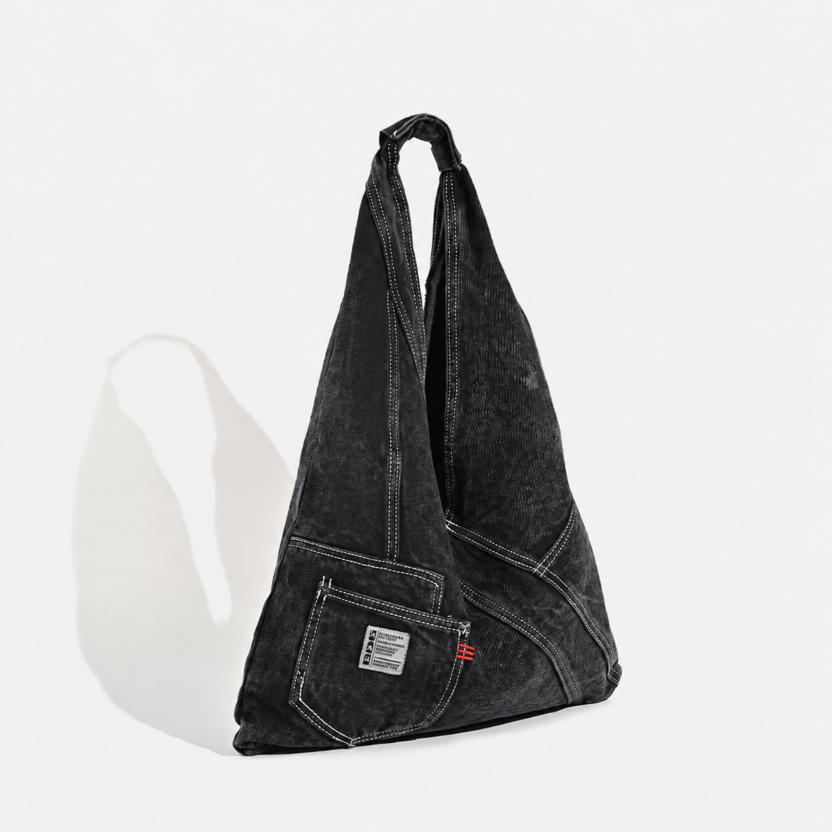 Denim triangle shoulder bag — black angle