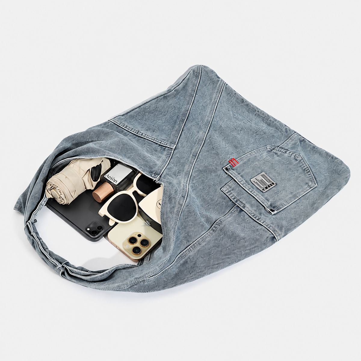 Denim triangle shoulder bag — capacity