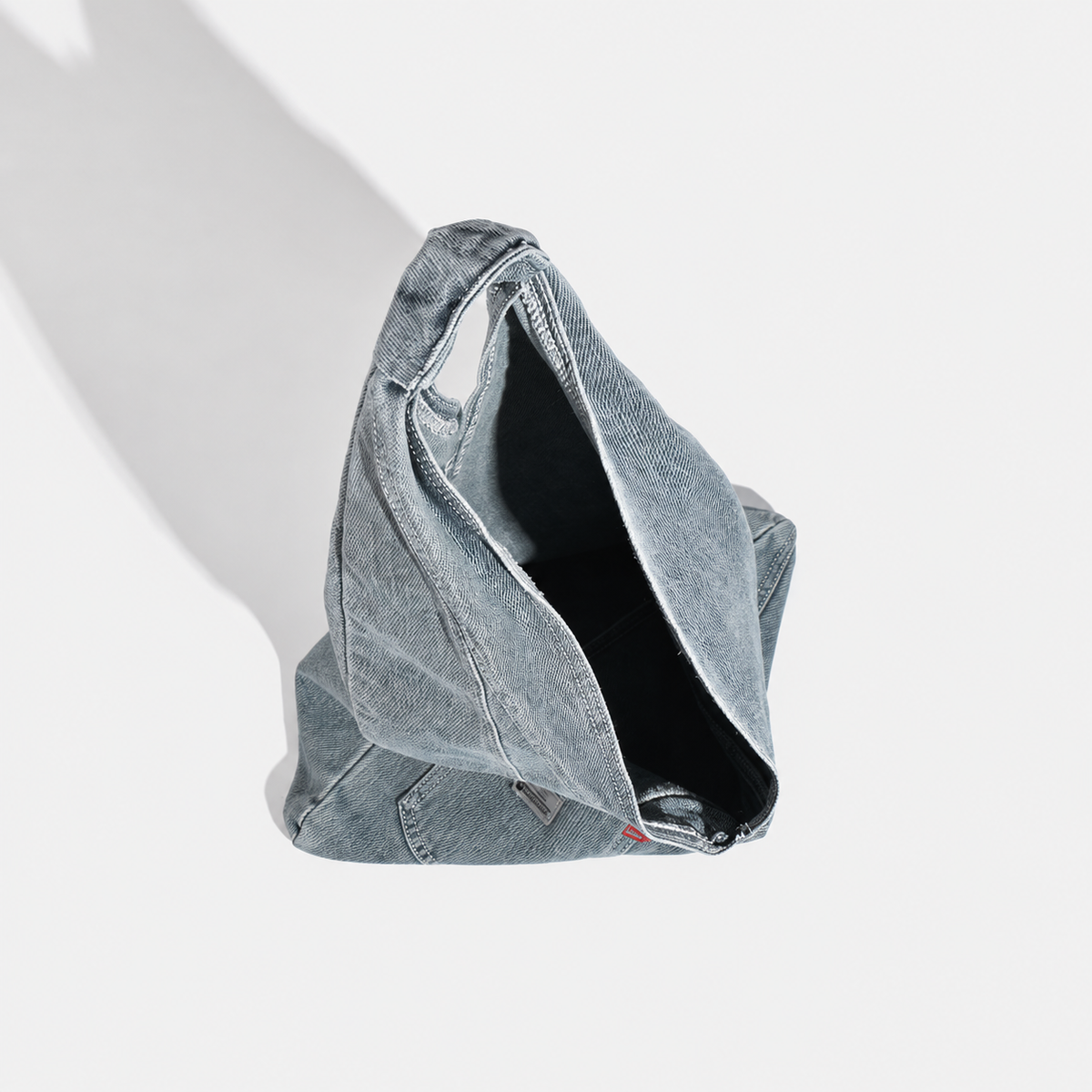 Denim triangle shoulder bag — interior