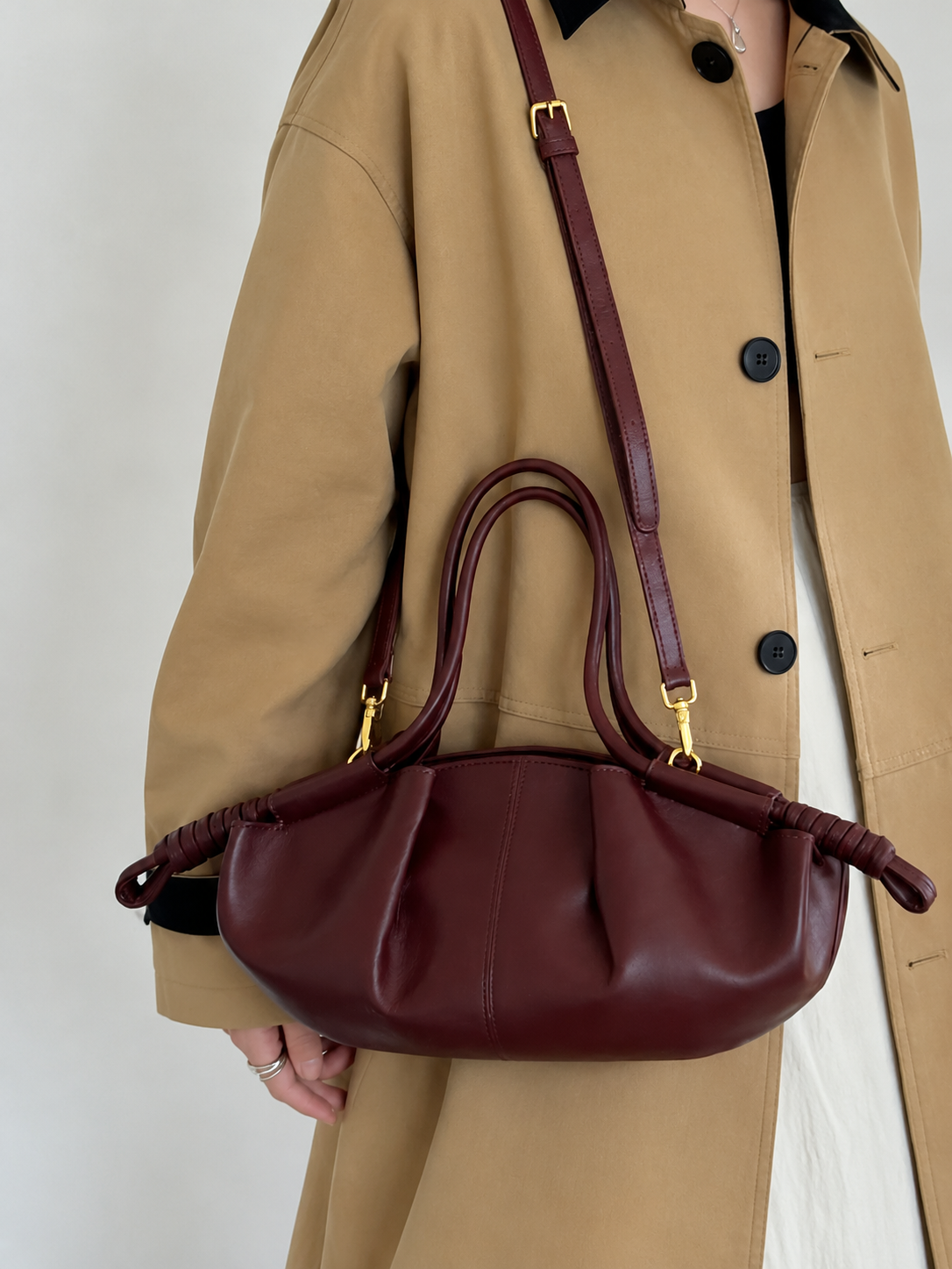 burgundy model pleated shoulder bag with wrapped side details