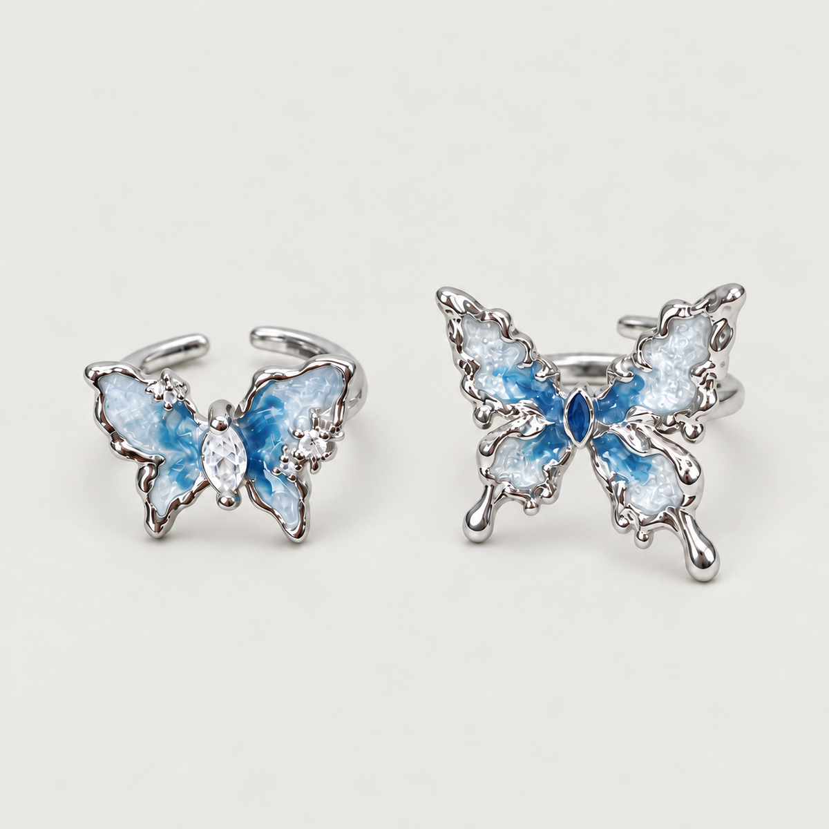Blue Butterfly Ring on a warm grey background