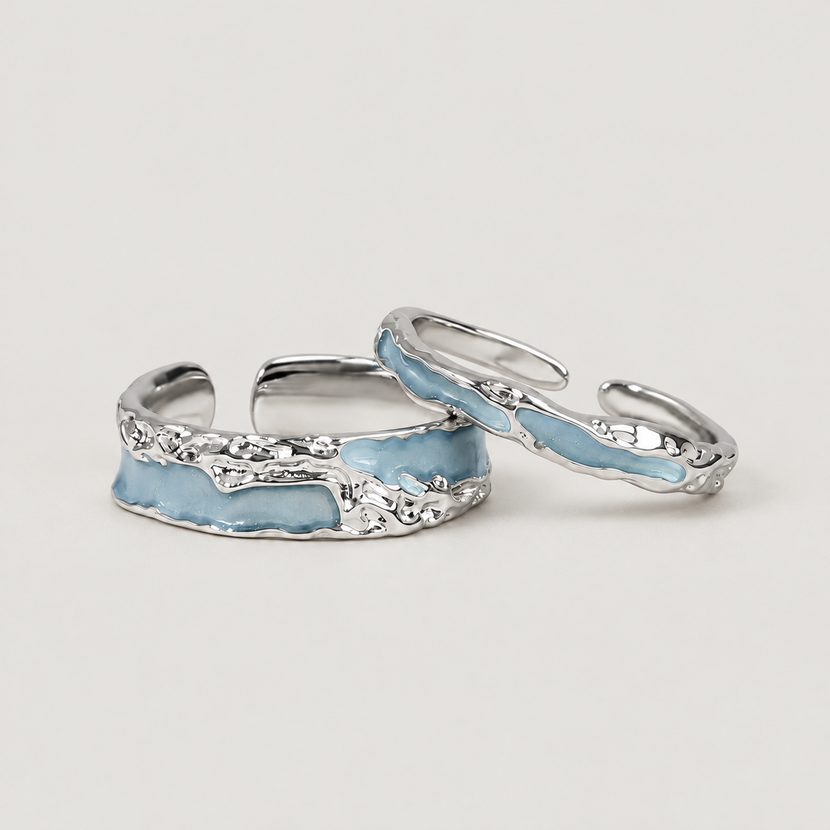 Blue Organic Open Ring on a warm grey background