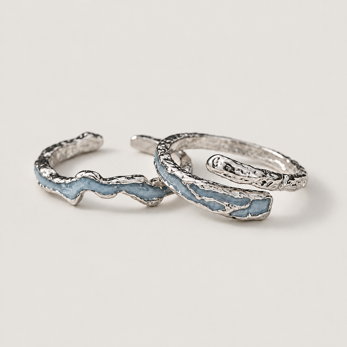 Blue Textured Open Ring on a warm grey background
