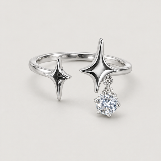Double Star Drop Ring on a warm grey background