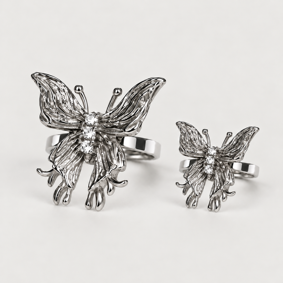 Sculpted Silver-Tone Butterfly Ring on a warm grey background