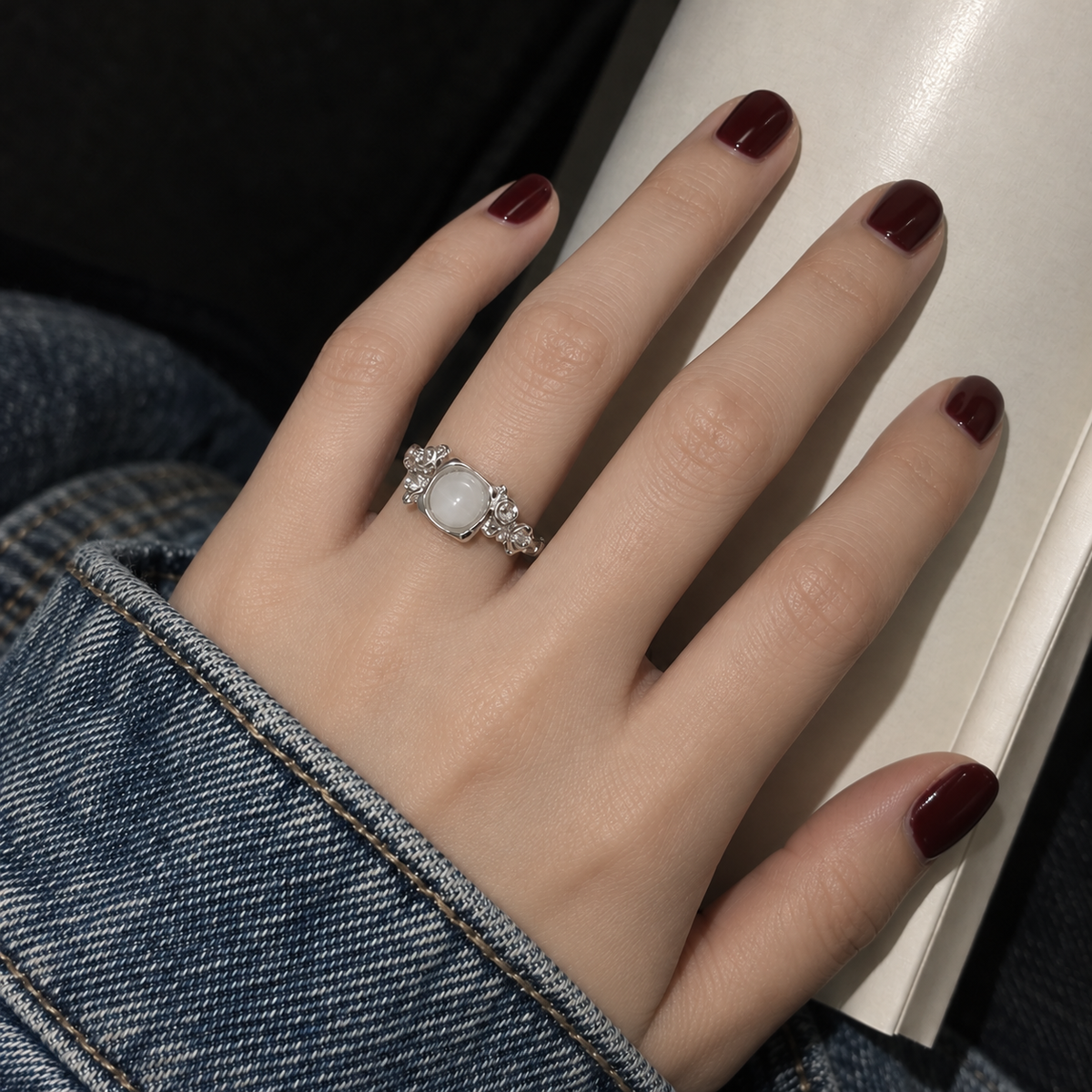 White stone rose ring hand close-up