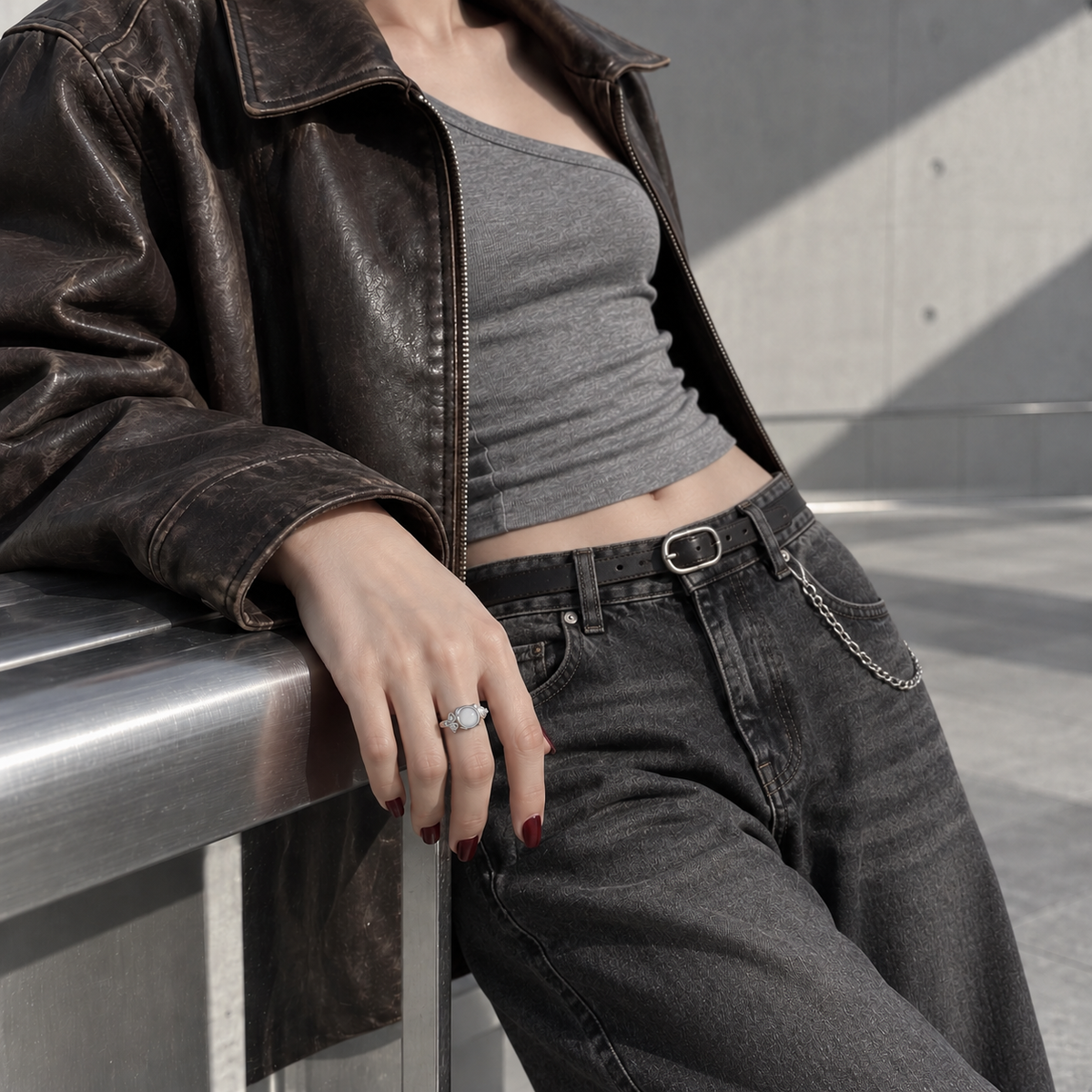 White stone rose ring styled with leather jacket