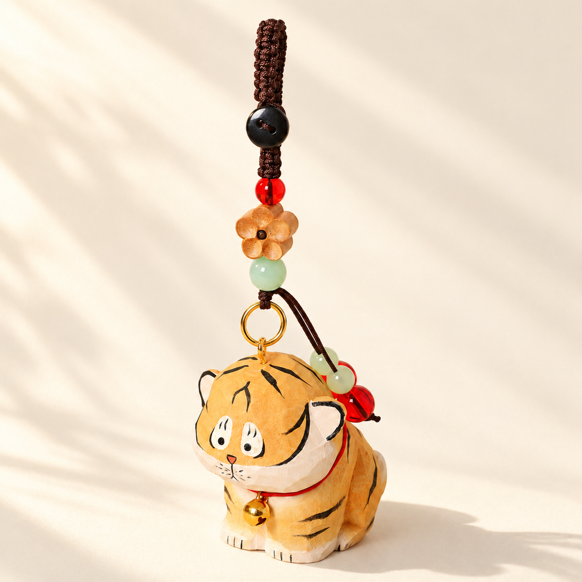 Tiger wooden charm on ivory background