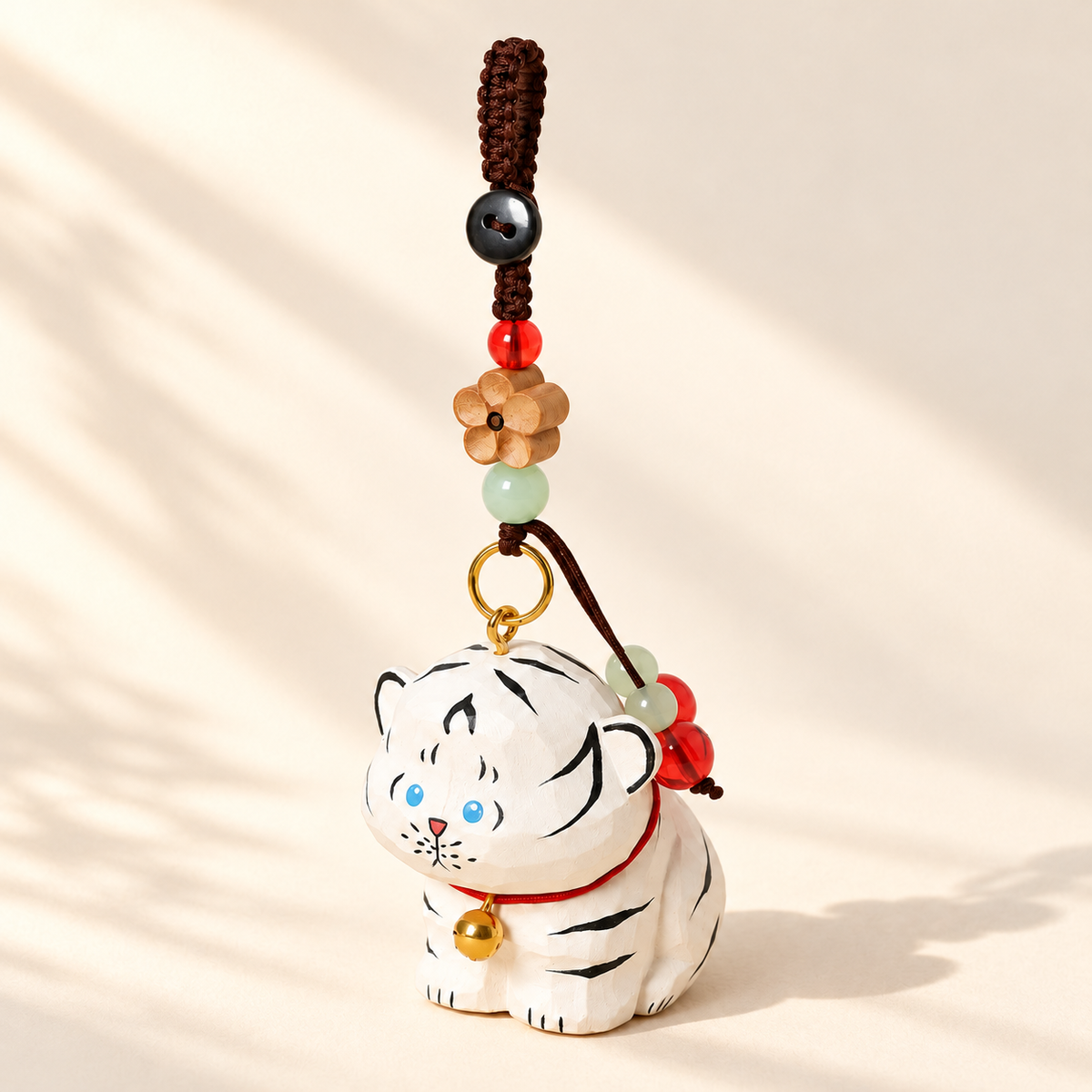 White Tiger wooden charm on ivory background